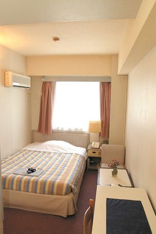Imagen de la habitación del Hotel New Marukatsu. Foto 10