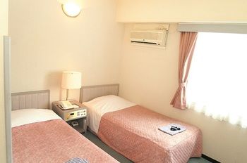Imagen de la habitación del Hotel New Marukatsu. Foto 12