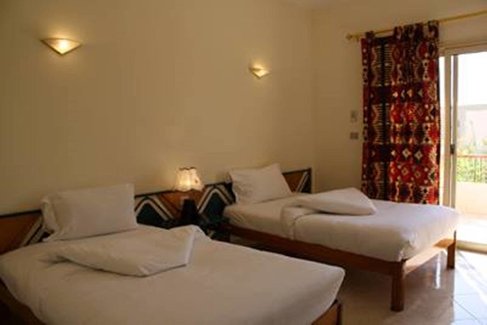 Imagen de la habitación del Hotel New Memnon. Foto 9