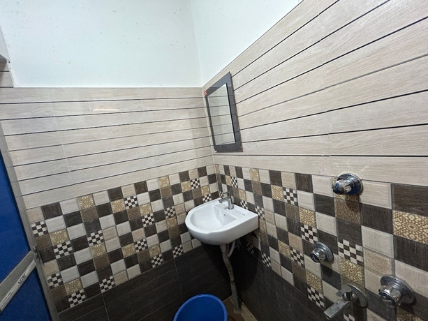 Imagen de la habitación del Hotel New Nayantara Lodge. Foto 8