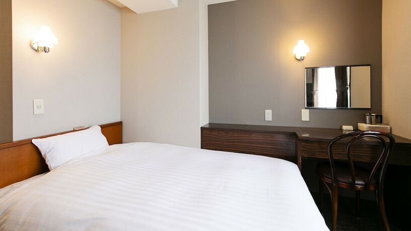 Imagen de la habitación del Hotel New Nishino. Foto 13