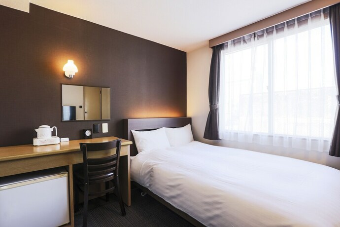 Imagen de la habitación del Hotel New Nishino. Foto 19