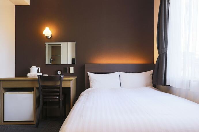 Imagen de la habitación del Hotel New Nishino. Foto 21