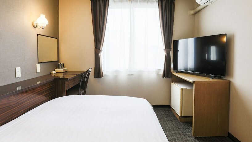 Imagen de la habitación del Hotel New Nishino. Foto 23