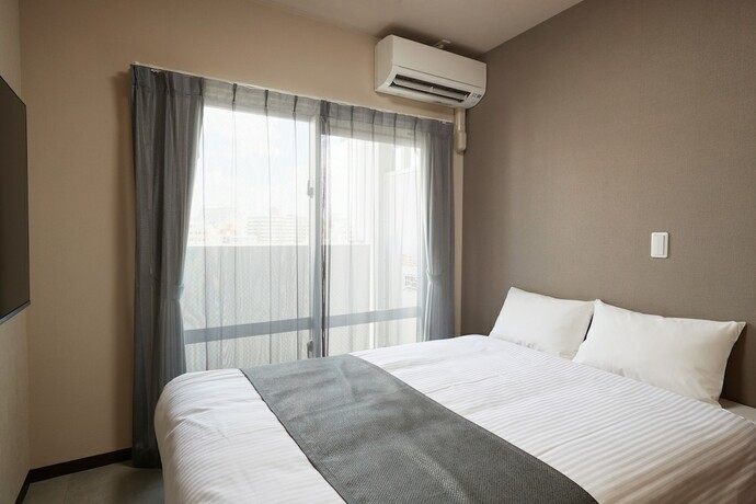 Imagen de la habitación del Hotel New Normal in MATSUYAMA. Foto 13
