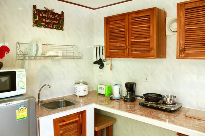 Imagen de la habitación del Hotel New Paradise Home Resort. Foto 10