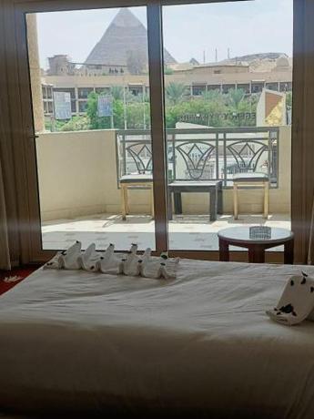 Imagen de la habitación del Hotel New Regency Pyramids View. Foto 18