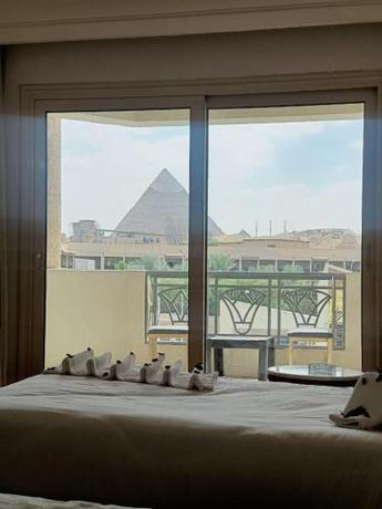 Imagen de la habitación del Hotel New Regency Pyramids View. Foto 19