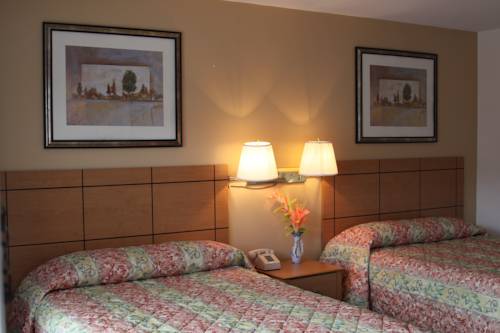 Imagen de la habitación del Hotel New Relax Inn. Foto 11