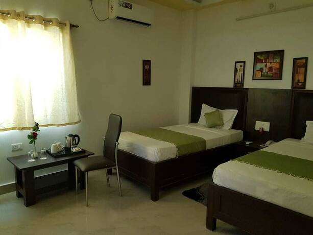 Imagen de la habitación del Hotel New Shiva. Foto 26