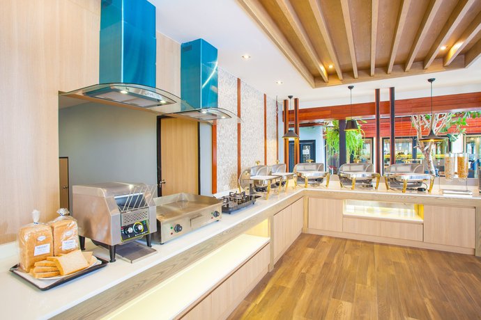 Imagen del bar/restaurante del Hotel New Siam Palace Ville. Foto 4