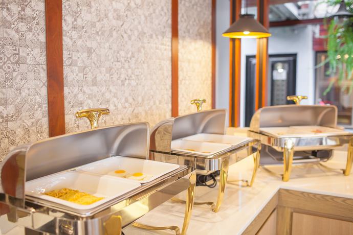 Imagen del bar/restaurante del Hotel New Siam Palace Ville. Foto 7