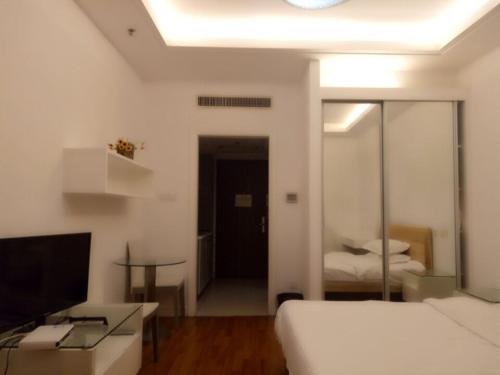 Imagen de la habitación del Hotel New Space New (zhongshan Park). Foto 8