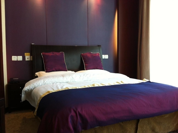 Imagen de la habitación del Hotel New Space - time Ruili Hotel. Foto 6