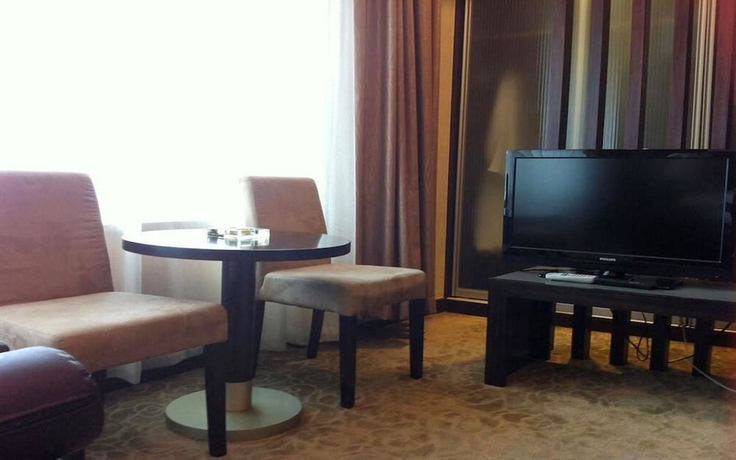Imagen de la habitación del Hotel New Space - time Ruili Hotel. Foto 12