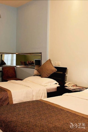 Imagen de la habitación del Hotel New Space - time Ruili Hotel. Foto 14