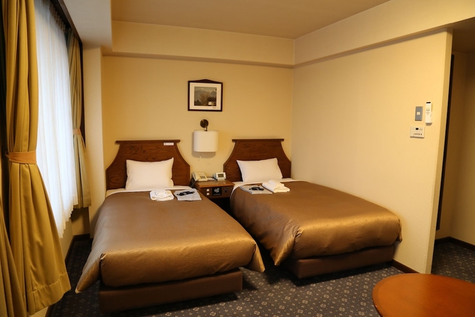 Imagen de la habitación del Hotel New Station, Matsumoto. Foto 8