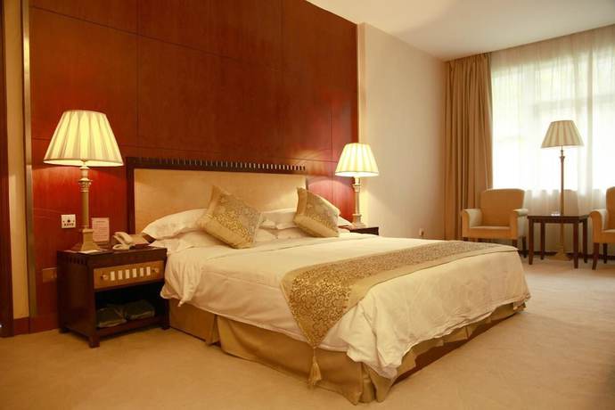 Imagen de la habitación del Hotel New Tai Garden Hotel. Foto 7