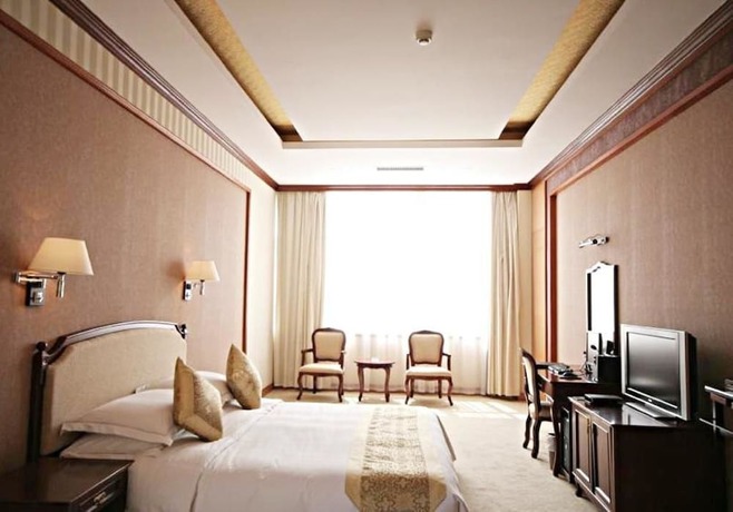 Imagen de la habitación del Hotel New Tai Garden Hotel. Foto 8