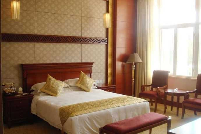 Imagen de la habitación del Hotel New Tai Garden Hotel. Foto 9