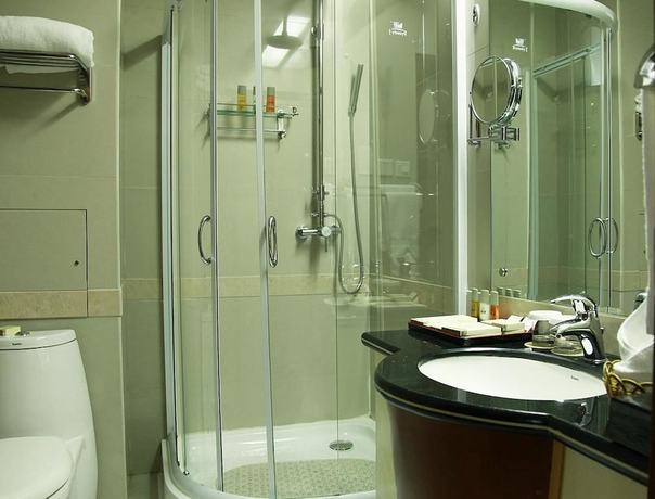 Imagen de la habitación del Hotel New Tai Garden Hotel. Foto 11