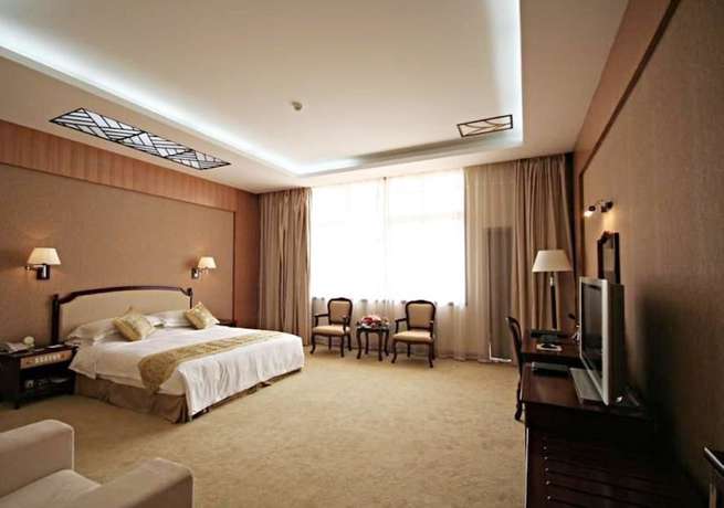Imagen de la habitación del Hotel New Tai Garden Hotel. Foto 12