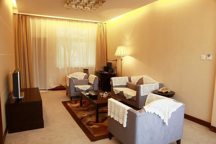 Imagen de la habitación del Hotel New Tai Garden Hotel. Foto 14