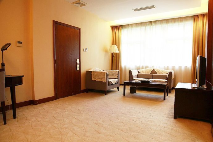 Imagen de la habitación del Hotel New Tai Garden Hotel. Foto 15