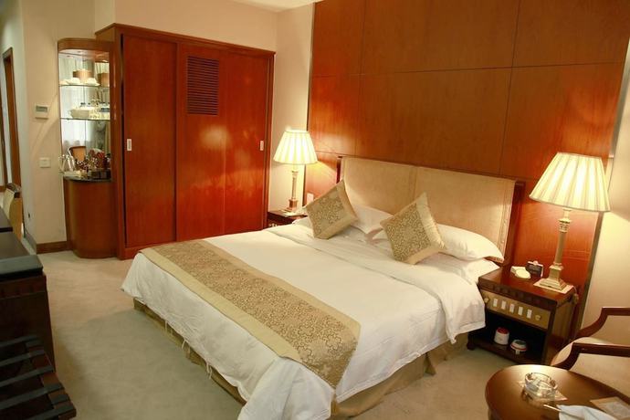 Imagen de la habitación del Hotel New Tai Garden Hotel. Foto 16