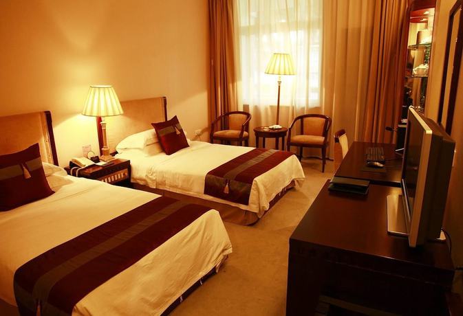 Imagen de la habitación del Hotel New Tai Garden Hotel. Foto 19