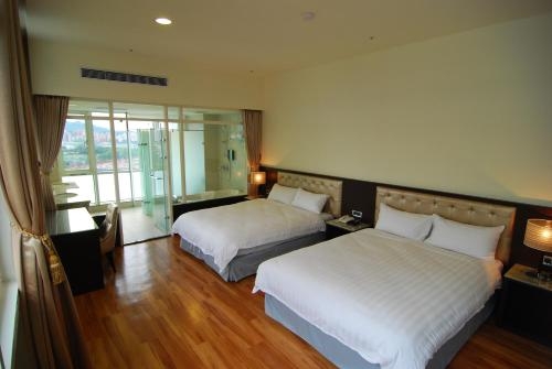 Imagen de la habitación del Hotel New Taipei Hot Spring. Foto 8