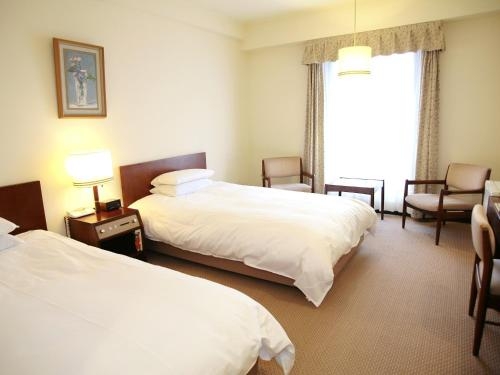 Imagen de la habitación del Hotel New Tanaka. Foto 7