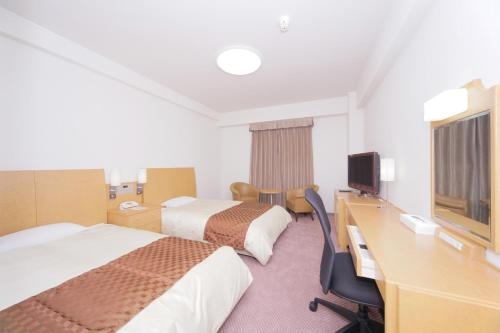 Imagen de la habitación del Hotel New Tanaka. Foto 9