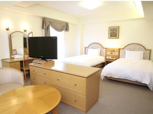 Imagen de la habitación del Hotel New Tanaka. Foto 10