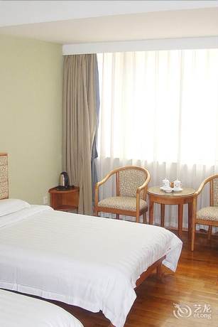 Imagen de la habitación del Hotel New Tian He. Foto 11