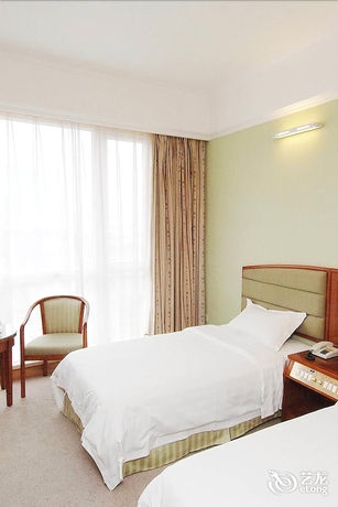 Imagen de la habitación del Hotel New Tian He. Foto 12