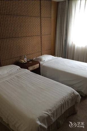 Imagen de la habitación del Hotel New Tian He. Foto 13