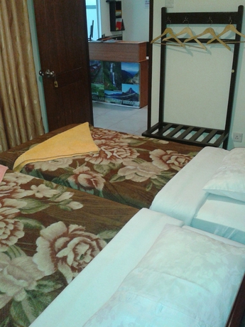 Imagen de la habitación del Hotel New Tour Inn. Foto 7