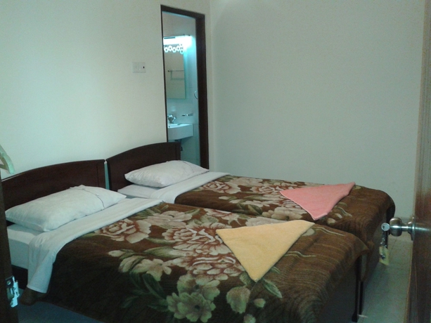 Imagen de la habitación del Hotel New Tour Inn. Foto 10