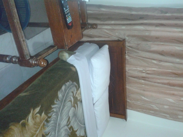 Imagen de la habitación del Hotel New Tour Inn. Foto 11