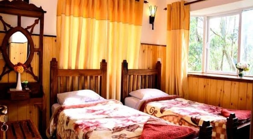 Imagen de la habitación del Hotel New Tour Inn. Foto 13