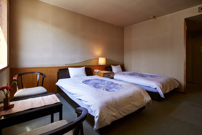 Imagen de la habitación del Hotel New Tsuruta. Foto 9