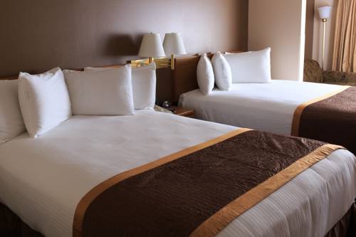 Imagen de la habitación del Hotel New Victorian Suites. Foto 9