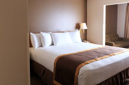 Imagen de la habitación del Hotel New Victorian Suites. Foto 11