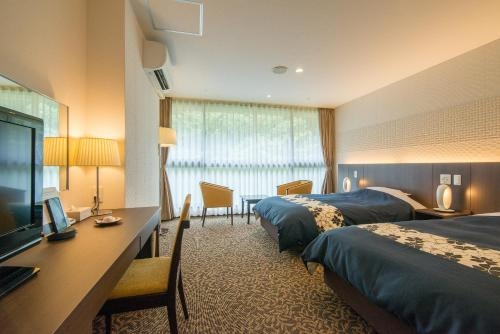 Imagen de la habitación del Hotel New Welcity Yugawara. Foto 6