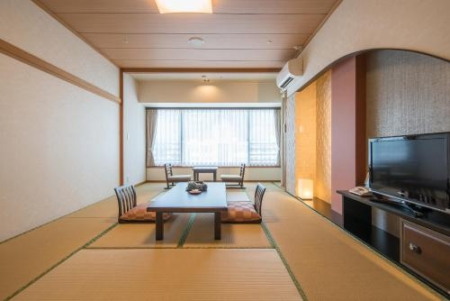 Imagen de la habitación del Hotel New Welcity Yugawara. Foto 8