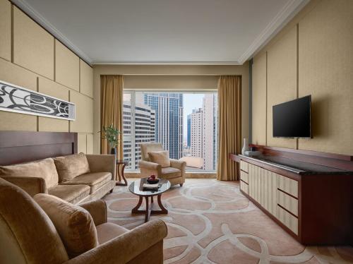 Imagen de la habitación del Hotel New World Dalian. Foto 2