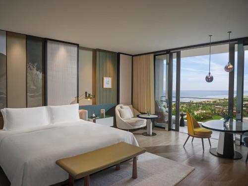 Imagen de la habitación del Hotel New World Hoiana Beach Resort. Foto 14