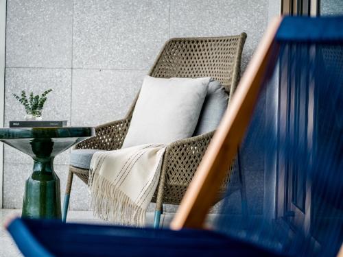 Imagen de la habitación del Hotel New World Hoiana Beach Resort. Foto 19