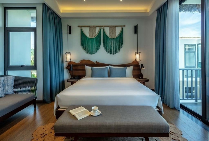 Imagen de la habitación del Hotel New World Phu Quoc Resort. Foto 13